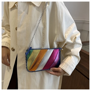 Detail of colorful metallic patchwork crossbody bag with silver studs and chain strap