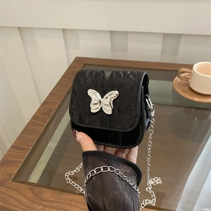 Minimalist black marble pattern saddle bag with silver butterfly buckle and chain strap