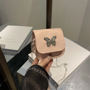 Pink mini saddle bag in lychee textured leather with silver butterfly buckle