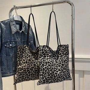 Large capacity leopard print tote bags in warm and cool tones with slim black straps