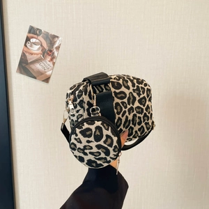 Chic leopard print crossbody bag with wide strap and matching round coin purse