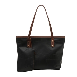 Grande borsa tote in pelle nera con cuciture geometriche e spalline marroni a contrasto