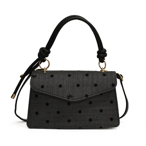 Chic herringbone gray polka dot crossbody bag with a bow accent and leather handle