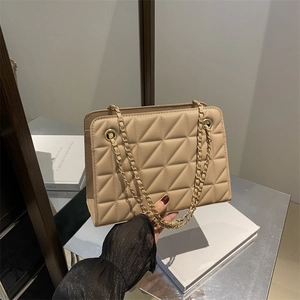 Fashionable beige quilted shoulder bag with chain strap and triangular stitching pattern