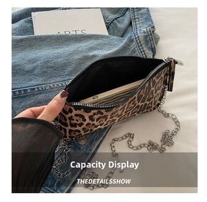 Internal view of leopard print crossbody bag showing spacious storage for a smartphone