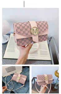 Detail of pink PU leather shoulder bag with gold M-logo buckle and monogram pattern