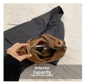Detail of a brown leather tote bag interior showing capacity for phone and lipstick