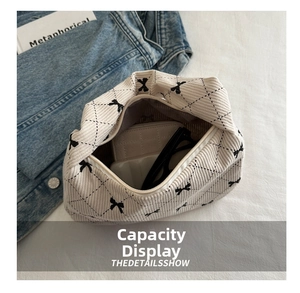 Top view of cream corduroy pillow bag showing spacious interior with bow pattern details