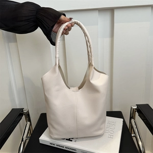 Chic cream lychee pattern bucket bag with wide integrated shoulder strap and large capacity