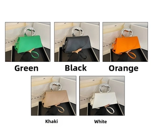 Detail showing five colors of geometric handbags with silver curved metal handles