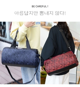 Detail view of large camouflage sports bags with sturdy carry handles and shoulder straps