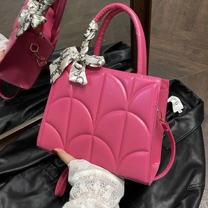 Deep rose pink leather tote with quilted fan patterns and silk scarf handle accent