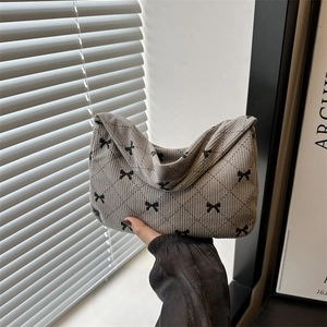 Grey corduroy handbag with quilted diamond pattern and black bow prints for women