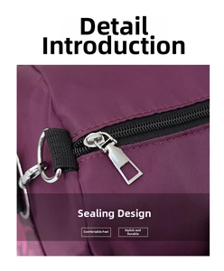 Detailed close-up of heavy-duty zipper and D-ring on camouflage travel bag fabric