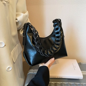 Vintage black crescent underarm bag with thick leather chain strap and smooth finish