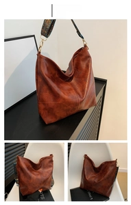 Detail of vintage brown PU leather tote bag with ethnic patterned wide woven strap