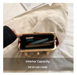 Interior view of red shell bag showing space for phone, lipstick and cosmetics