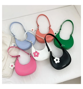 Detailed collection of colorful crescent underarm bags with floral charm accessories
