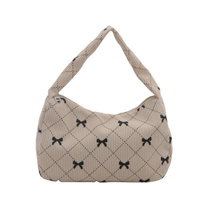 Chic beige corduroy crescent underarm bag with black bow and polka dot print pattern