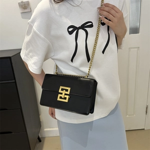 Classic black rectangular flap bag with gold geometric buckle and metal chain strap