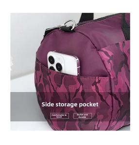 Detail of purple camo travel bag showing convenient side pocket for smartphone storage