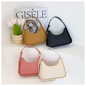 Detailed close-up of stylish faux leather underarm bags in four pastel colors on a shelf