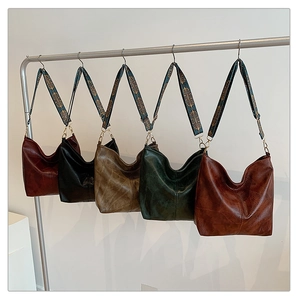 Hobo bags in five colors featuring ethnic style embroidered wide shoulder straps