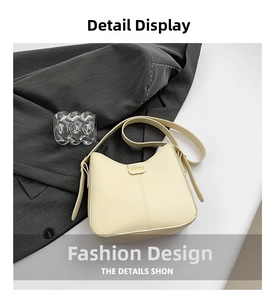 Detail showing beige PU leather shoulder bag with FASHION buckle on a grey suit