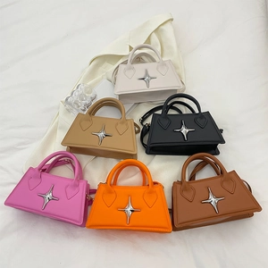 Detailed view of six mini trapezoid handbags in various colors with star hardware details