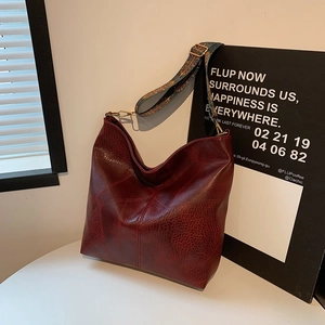 Retro burgundy large capacity leather tote bag with stylish colorful ethnic strap