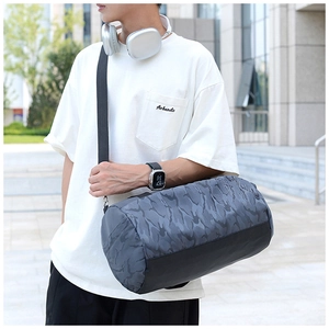 Large capacity dark grey camo gym bag with shoulder strap shown in a crossbody style