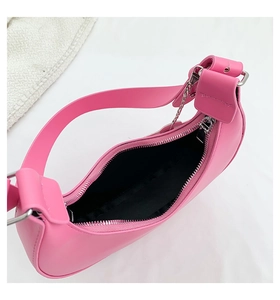 Top view showing pink hobo bag interior with black lining and silver zipper detail