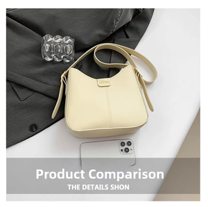 Detail of cream bucket bag showing lychee grain leather and fashion metal plaque