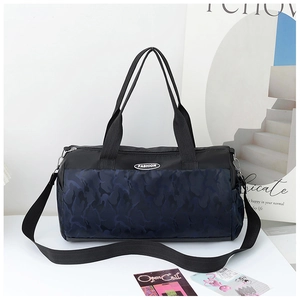 Detail of camoufalge travel bag with adjustable strap and durable nylon material