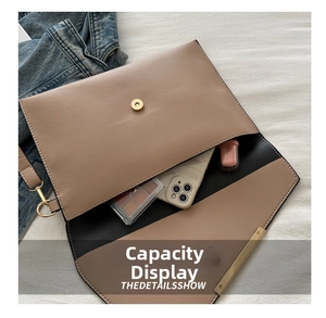 Interior view of beige envelope clutch showing space for phone and makeup items