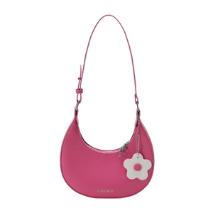 Pink crescent underarm bag with smooth leather finish and a floral charm pendant