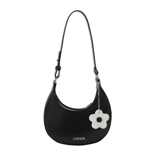 Chic black crescent moon hobo bag with a stylish white sun flower charm and leather strap