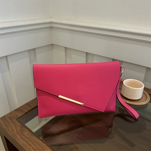 Elegant rose red envelope clutch bag with gold metal trim and wristlet strap