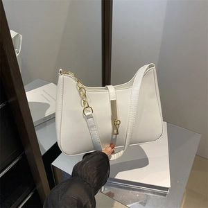 Minimalist white hobo shoulder bag with golden chain and metallic lock detail