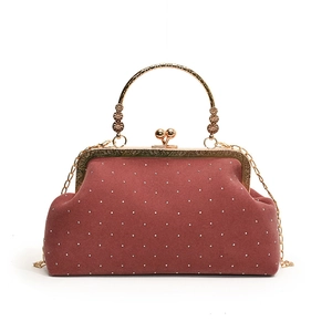 Vintage reddish brown suede shell bag with metal studs and engraved gold floral handle