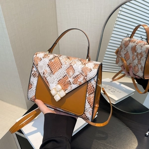 Brown faux leather crossbody bag with snakeskin pattern and marble-textured buckle