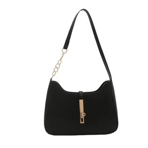 Minimalist black leather underarm bag with gold hardware and chain strap for women