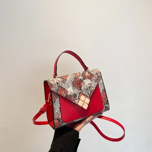 Minimalist red leather shoulder bag with snake skin pattern and geometric accent