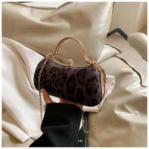 Detail of leopard print evening bag with champagne gold hardware and crystal clasp