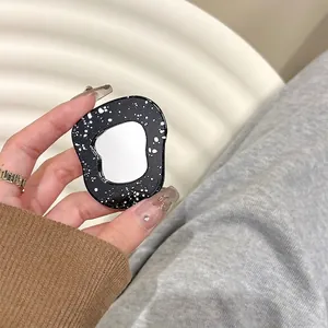 Support téléphone miroir noir effet éclaboussures d'étoiles avec cadre irrégulier