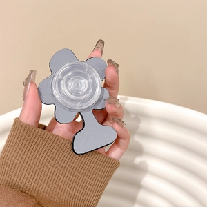 Détail du support de téléphone en forme de fleur avec finition grise et base rétractable