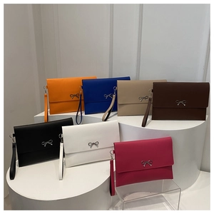 Fashionable slim envelope clutch bags in seven vibrant colors with silver bow buckle