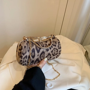Elegant leopard print evening clutch with gold rhinestone handle and chain strap
