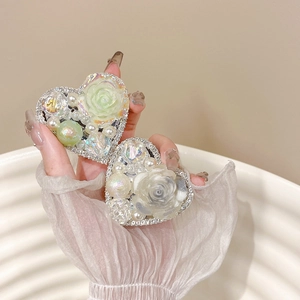 Elegant floral pearl heart phone grip with rhinestones held in a lace glove