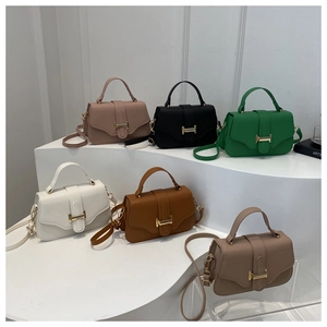 Detailed view of luxury leather crossbody bags with gold H-shaped metal buckles in six colors